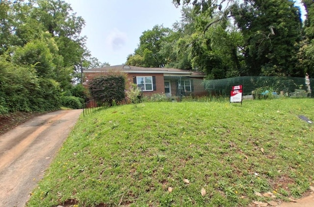 952 N Ave, Macon, GA 31211 - ranch-style house with brick siding and a front lawn