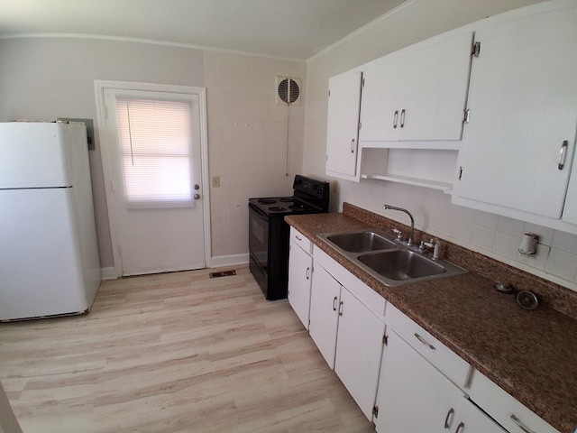 952 N Ave, Macon, GA 31211 - kitchen featuring freestanding refrigerator, black electric range oven, a sink, white cabinets, and crown molding
