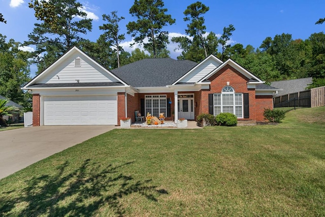 view of front facade with a front yard and a garage