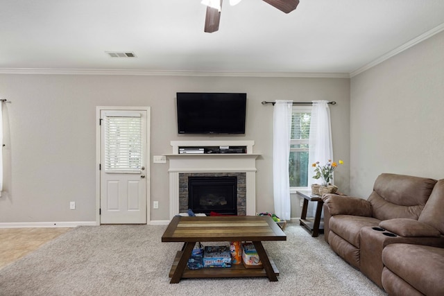 1417 Cloverdale Rd, Columbus, GA 31904 - living room with ceiling fan, ornamental molding, a stone fireplace, and carpet flooring