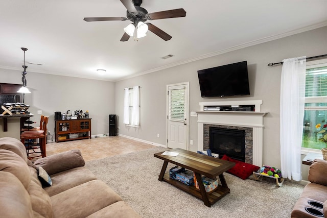 1417 Cloverdale Rd, Columbus, GA 31904 - living room featuring crown molding, ceiling fan, and a stone fireplace