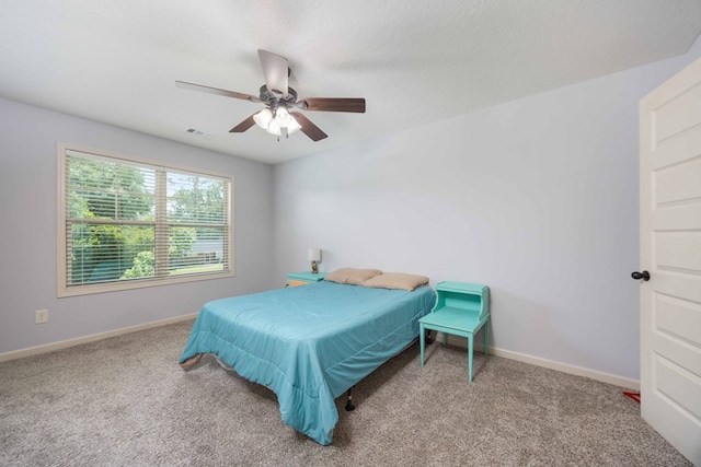 1417 Cloverdale Rd, Columbus, GA 31904 - carpeted bedroom with baseboards and a ceiling fan
