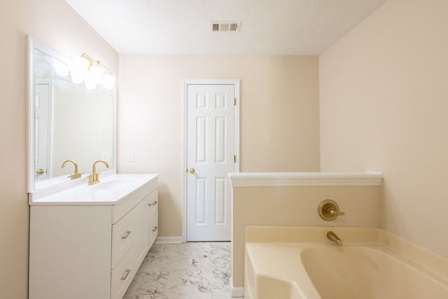 924 Vista Dr, Columbus, GA 31907 - full bath featuring visible vents, marble finish floor, a garden tub, and vanity