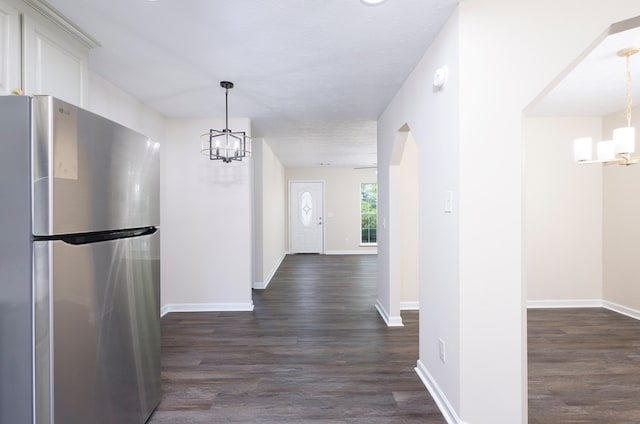 924 Vista Dr, Columbus, GA 31907 - hall featuring dark wood-style flooring, baseboards, and a notable chandelier