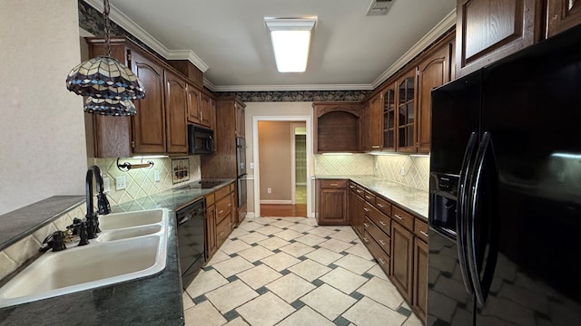 kitchen featuring decorative backsplash, ornamental molding, dark brown cabinets, sink, and black appliances