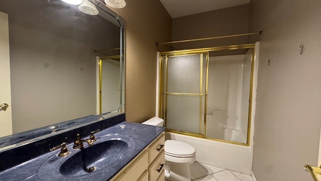 full bathroom with tile patterned flooring, vanity, toilet, and bath / shower combo with glass door