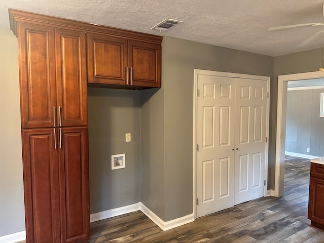 kitchen with a textured ceiling, ceiling fan, and dark hardwood / wood-style floors