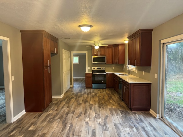 kitchen featuring plenty of natural light, sink, and appliances with stainless steel finishes