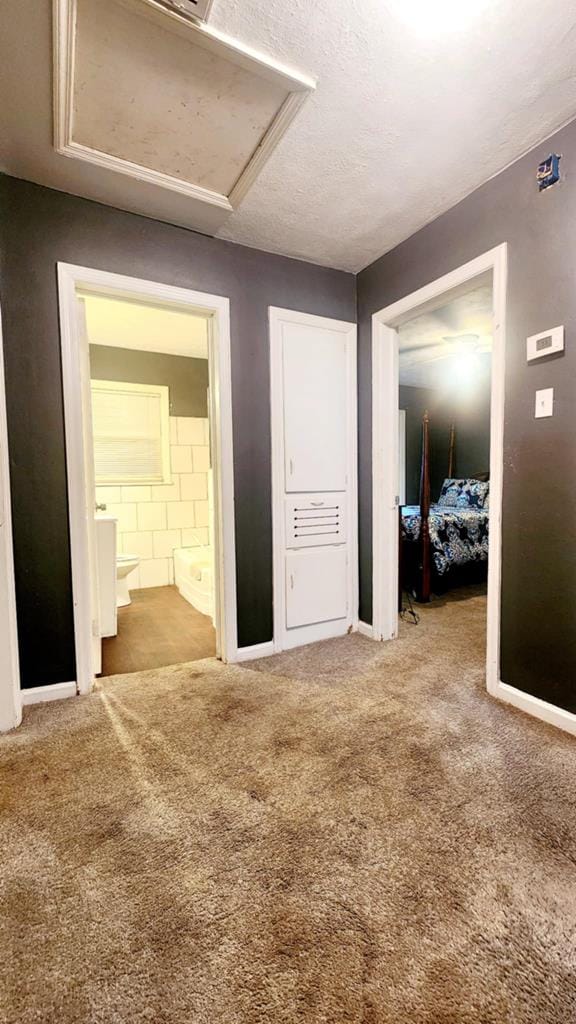 1434 John Smith Ave, Columbus, GA 31903 - unfurnished bedroom with carpet flooring, ensuite bathroom, and attic access