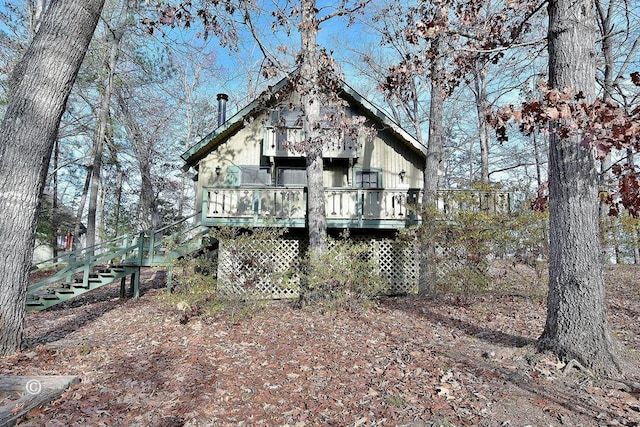 back of property with a wooden deck