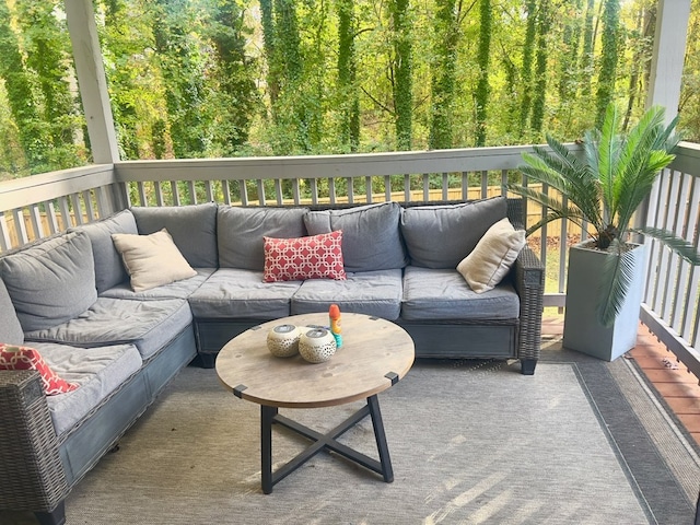 6840 Hidden Lake Dr, Rex, GA 30273 - wooden deck with an outdoor hangout area and a view of trees