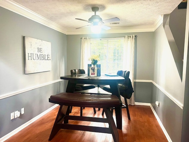 6840 Hidden Lake Dr, Rex, GA 30273 - dining room with wood finished floors, a textured ceiling, crown molding, and ceiling fan