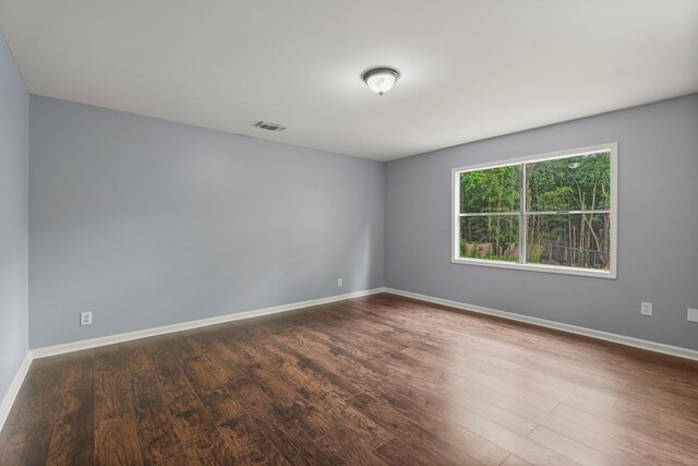 8344 Twin Chapel Dr, Columbus, GA 31904 - empty room featuring visible vents, dark wood finished floors, and baseboards