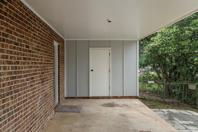 8344 Twin Chapel Dr, Columbus, GA 31904 - property entrance featuring a patio, brick siding, board and batten siding, and fence