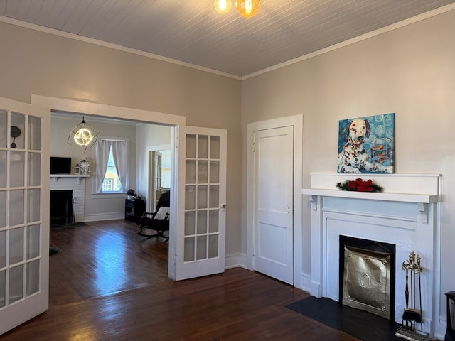 unfurnished living room with french doors, crown molding, a fireplace, dark hardwood / wood-style flooring, and wood ceiling