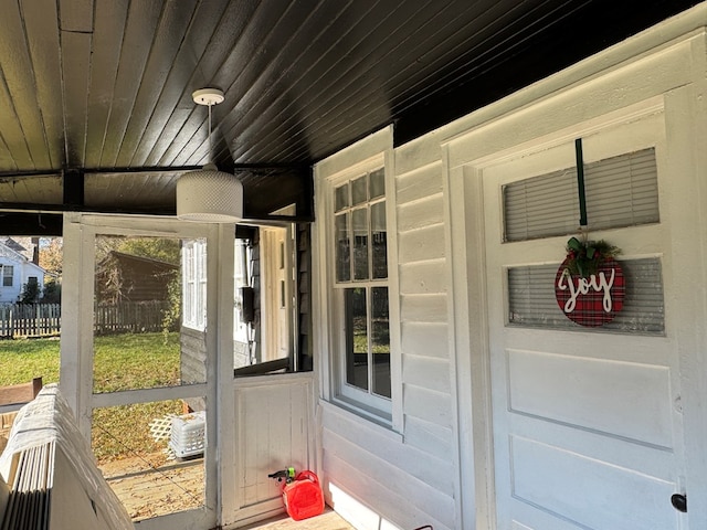 sunroom featuring wooden ceiling