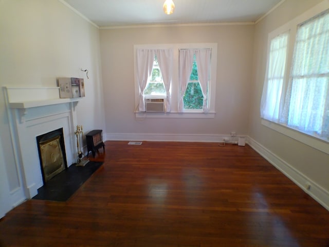 unfurnished living room with cooling unit, dark hardwood / wood-style flooring, and crown molding