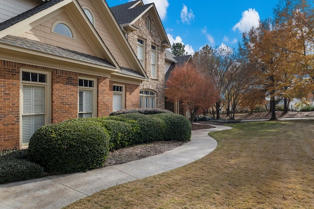 view of property's community with a lawn