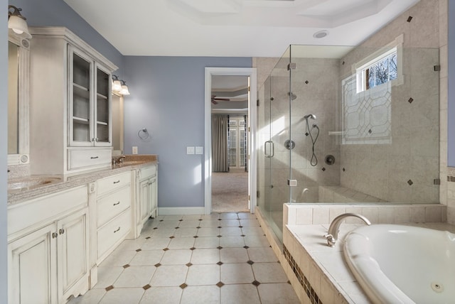 bathroom featuring vanity and separate shower and tub