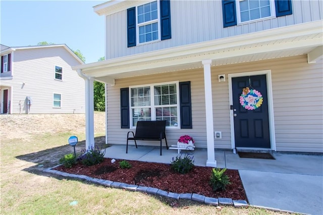 doorway to property with a porch