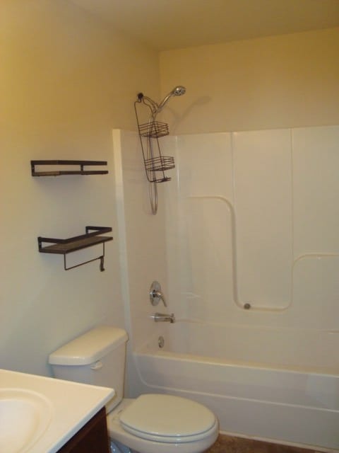 full bathroom with vanity, toilet, and bathing tub / shower combination