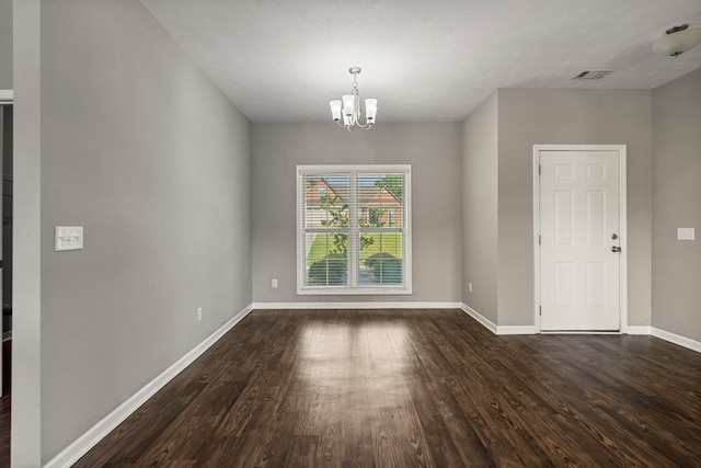 3102 Gatewood Dr, Phenix City, AL 36870 - unfurnished dining area with dark wood finished floors and a chandelier