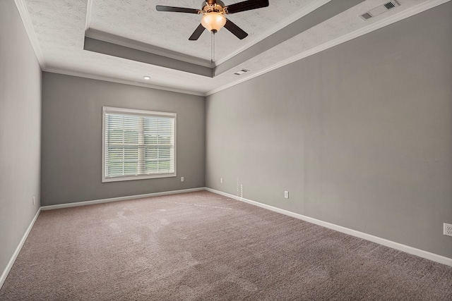 3102 Gatewood Dr, Phenix City, AL 36870 - empty room with a tray ceiling, carpet, a textured ceiling, ceiling fan, and crown molding