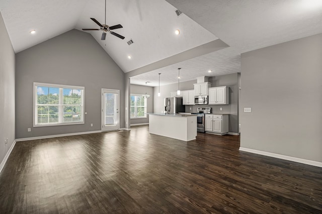 3102 Gatewood Dr, Phenix City, AL 36870 - unfurnished living room featuring dark wood-type flooring, a ceiling fan, high vaulted ceiling, recessed lighting, and a chandelier