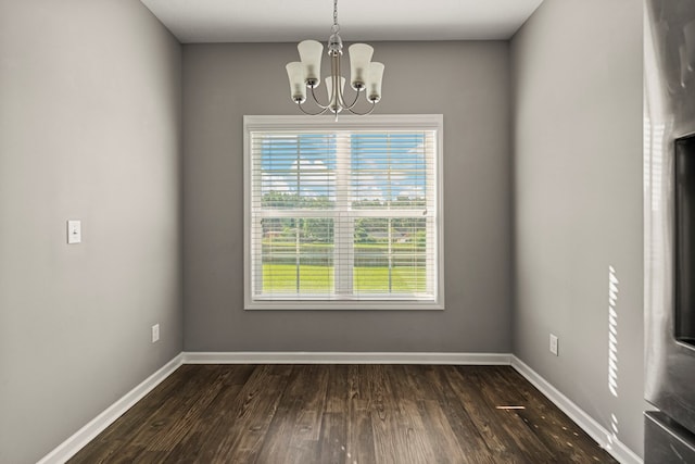 3102 Gatewood Dr, Phenix City, AL 36870 - empty room with a chandelier, healthy amount of natural light, and dark wood-type flooring