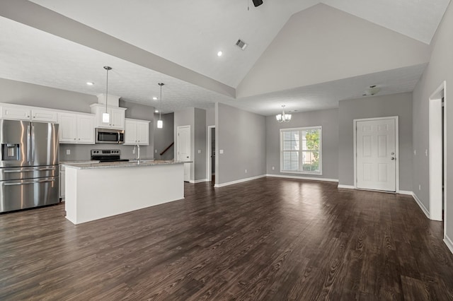 3102 Gatewood Dr, Phenix City, AL 36870 - unfurnished living room with high vaulted ceiling, dark wood finished floors, a ceiling fan, recessed lighting, and a chandelier
