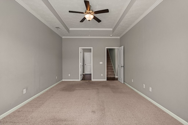 3102 Gatewood Dr, Phenix City, AL 36870 - unfurnished bedroom with a tray ceiling, carpet flooring, ensuite bathroom, a ceiling fan, and crown molding