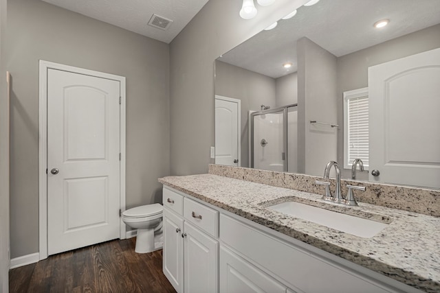 3102 Gatewood Dr, Phenix City, AL 36870 - bathroom featuring a stall shower, vanity, wood finished floors, and recessed lighting
