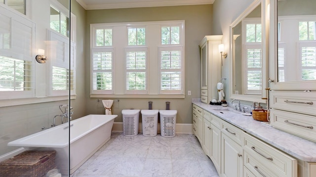 7718 River Crest Dr, Columbus, GA 31904 - bathroom with a freestanding tub, vanity, marble finish flooring, crown molding, and baseboards