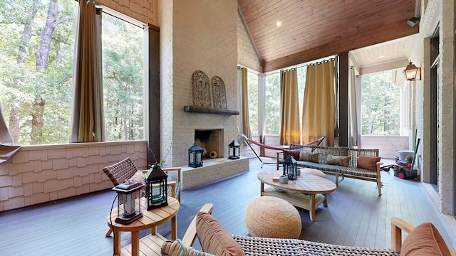 7718 River Crest Dr, Columbus, GA 31904 - living room with high vaulted ceiling, an outdoor brick fireplace, wooden ceiling, and hardwood / wood-style flooring