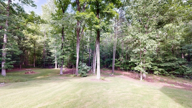 7718 River Crest Dr, Columbus, GA 31904 - view of green lawn featuring a wooded view