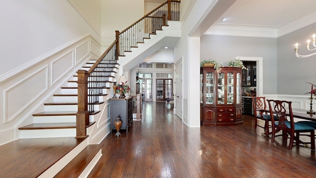 7718 River Crest Dr, Columbus, GA 31904 - foyer entrance with a decorative wall, stairway, wood-type flooring, ornamental molding, and wainscoting