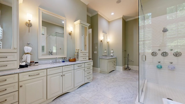 7718 River Crest Dr, Columbus, GA 31904 - bathroom featuring a stall shower, two vanities, crown molding, and recessed lighting