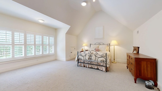 7718 River Crest Dr, Columbus, GA 31904 - carpeted bedroom featuring lofted ceiling and baseboards