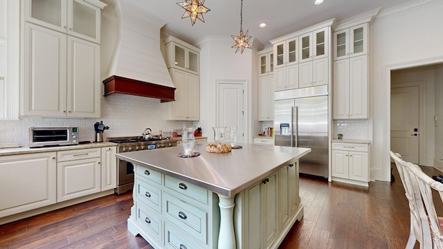 7718 River Crest Dr, Columbus, GA 31904 - kitchen featuring high quality appliances, crown molding, recessed lighting, decorative backsplash, and a kitchen island
