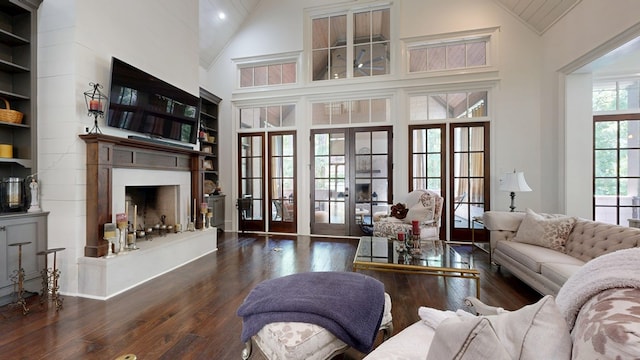 7718 River Crest Dr, Columbus, GA 31904 - living area with wood-type flooring, a fireplace with raised hearth, french doors, high vaulted ceiling, and recessed lighting