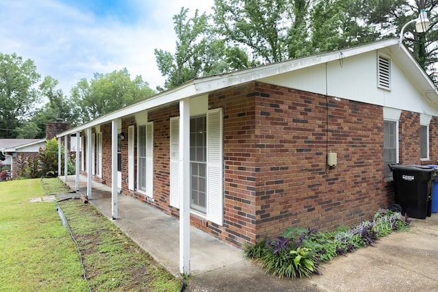 433 Olsen Ave, Columbus, GA 31907 - view of side of property featuring brick siding, a yard, and a patio area