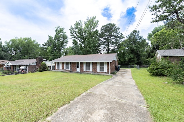 433 Olsen Ave, Columbus, GA 31907 - single story home with concrete driveway, brick siding, and covered porch