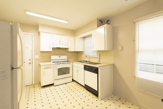 433 Olsen Ave, Columbus, GA 31907 - kitchen with white appliances, white cabinets, light countertops, and light floors