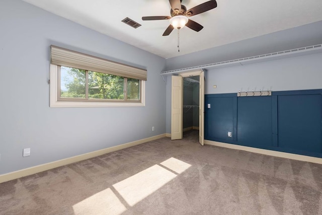 175 Slaughter Dr, Waverly Hall, GA 31831 - unfurnished bedroom with carpet flooring, a closet, and ceiling fan