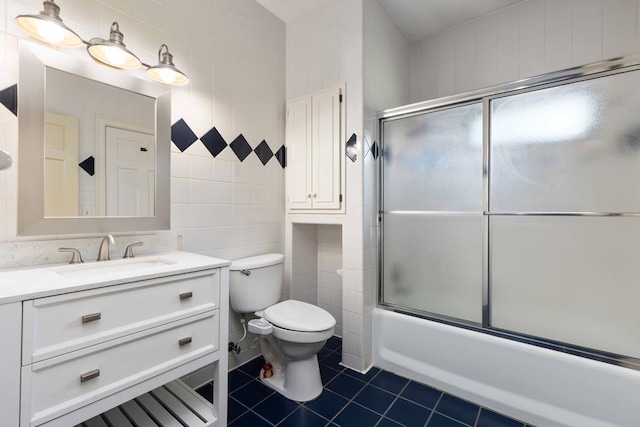 175 Slaughter Dr, Waverly Hall, GA 31831 - full bath featuring tile walls, vanity, combined bath / shower with glass door, and tile patterned flooring