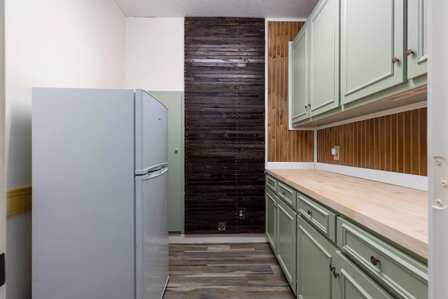 175 Slaughter Dr, Waverly Hall, GA 31831 - kitchen with freestanding refrigerator, green cabinetry, dark wood-type flooring, wooden counters, and a textured ceiling