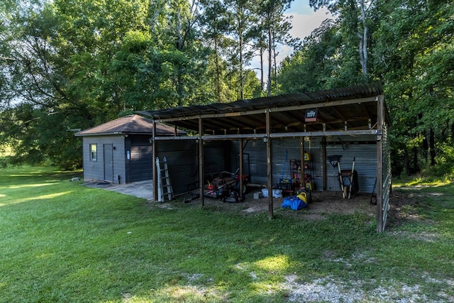 175 Slaughter Dr, Waverly Hall, GA 31831 - view of pole building with a yard and a carport