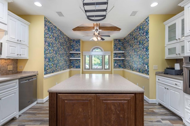 175 Slaughter Dr, Waverly Hall, GA 31831 - kitchen featuring stainless steel appliances, wallpapered walls, wood finished floors, white cabinets, and a ceiling fan