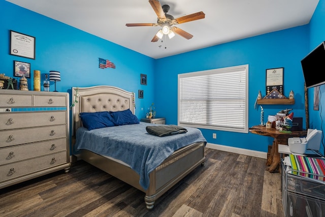 bedroom featuring dark wood finished floors, ceiling fan, and baseboards