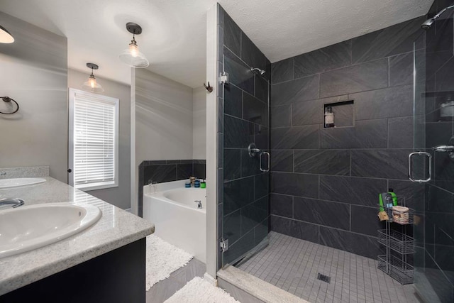 full bathroom with double vanity, a stall shower, a sink, and a bath